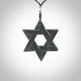 Hand carved New Zealand Tangiwai Pounamu Magen David necklace. Unique and creative art to wear from New Zealand Tangiwai Pounamu. Hand made New Zealand Tangiwai star of david pendant. Magen David pendant for men and women.
